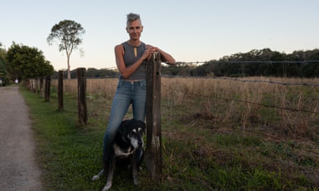 Mullumbimby resident Nikki Malone stands at her property with a dog